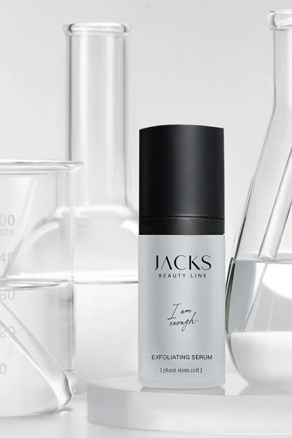 JACKS beauty line Exfoliating Serum Flasche neben drei Reagenzgläsern