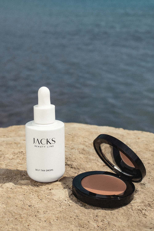 #farbwunsch_bronzer, #farbwunsch_glow-bronzer, JACKS beauty line Self Tan Drops und Glow Bronzer vor Meereskulisse