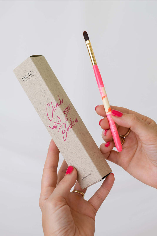 Lippenpinsel im pink Design mit Verpackung pink charity