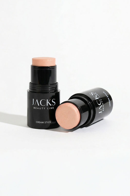 Ein stehender und ein liegender JACKS beauty line Highlighter Cream Stick nebeneinander