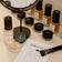 Viele JACKS beauty line Make-up Produkte wie Foundation, Concealer und Pinsel liegen auf einem Tisch